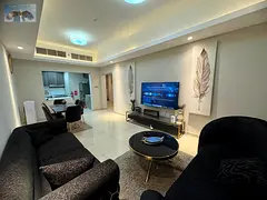 For rent in Ajman, a two-bedroom apartment with a living room in Gulf Tower, featuring a gym, swimmi