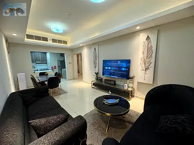 For rent in Ajman, a two-bedroom apartment with a living room in Gulf Tower, featuring a gym, swimm
