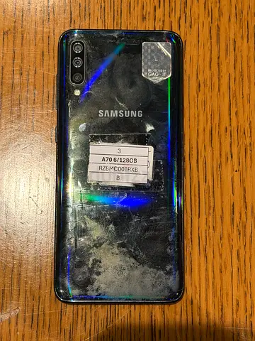 Used Samsung smartphone (back shows wear) - for parts or repair