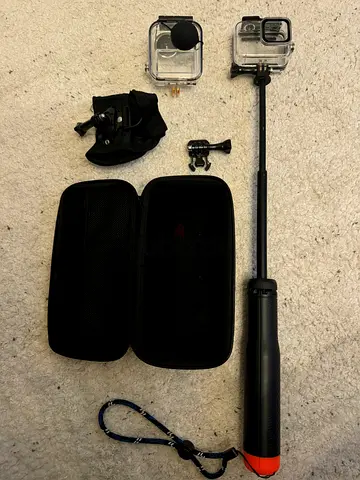 GoPro action camera kit with floating hand grip, mounts and cases. GoPro Not Included