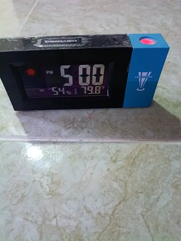 Digital alarm clock with temperature and humidity display