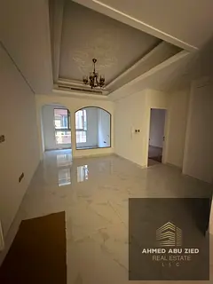 Elegant 1‑BR apartment in Al Mowaihat 3, living room, 2 baths, wardrobes, balcony, modern finishes