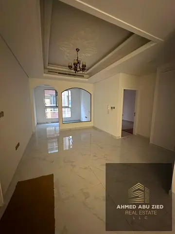 Elegant 1‑BR apartment in Al Mowaihat 3, living room, 2 baths, wardrobes, balcony, modern finishes, prime location, plus 1 free month. Rent 37,000 AED
