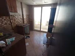 1-bedroom apartment with living room for annual rent in Al Butina, Sharjah Master bedroom Kitchen Ba