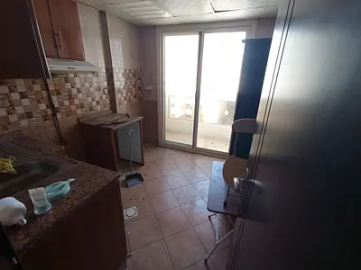 1-bedroom apartment with living room for annual rent in Al Butina, Sharjah Master bedroom Kitchen Balcony 2 bathrooms Close to Lulu Hypermarket
