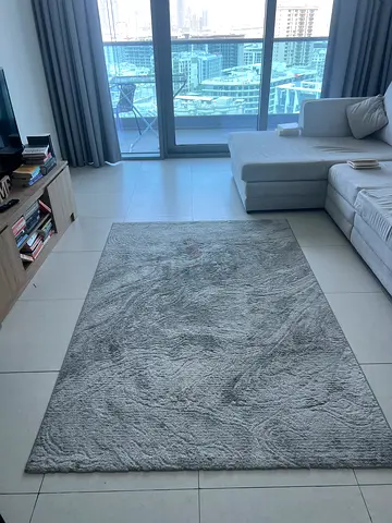 Light grey textured area rug - good condition
