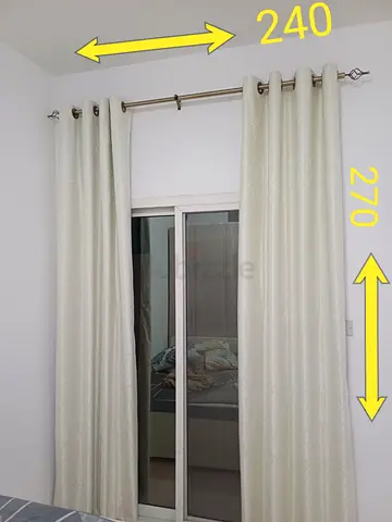Pair of cream blackout eyelet curtains with curtain rod - 240 x 270 cm