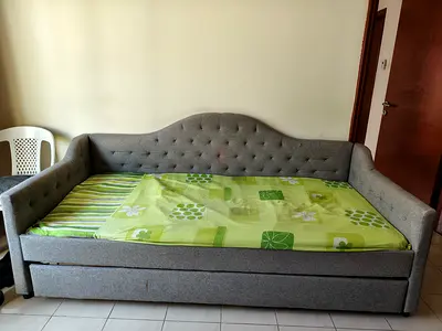 Grey fabric daybed with trundle