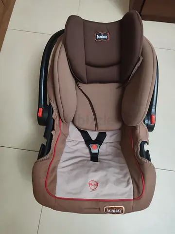 Brown infant car seat (rear-facing) in good used condition
