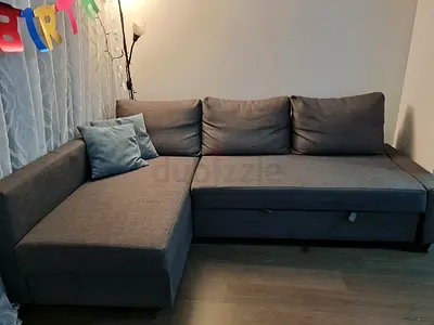 Gray L-shaped Sofa Bed with Storage - Good Condition