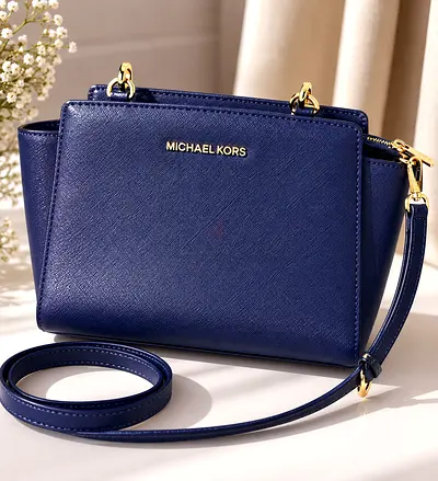 Original Micheal Kors sling bag with gold hardware - good condition