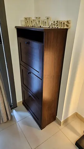 IKEA Brusali - Tall dark wood shoe cabinet with three drawers