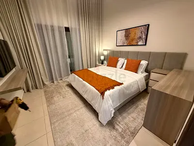 Modern upholstered queen bed with bedside tables and mattress