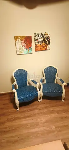 Pair of vintage-style blue upholstered armchairs with white wooden frames