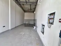 Title: 750 Sqft Commercial Shop for Rent in Hoshi | Prime Main Road Location | AED 60,000/year