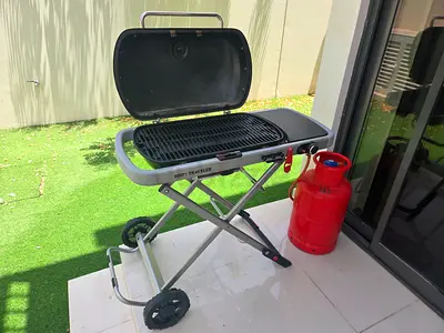 Weber Traveler portable gas BBQ grill with small gas cylinder - foldable.
