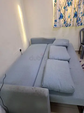 Light grey 3-seater fabric sofa bed with storage in good condition