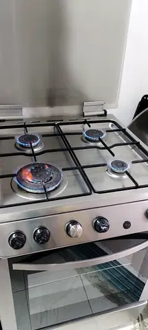 Stainless Steel 4-Burner Gas Stove with Oven - Good Working Condition