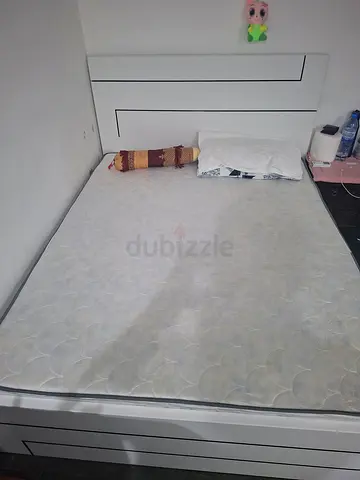 White double bed frame with mattress