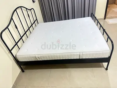 almost new IKEA king bed with mattress 180cm x 200cm, used as a guests bed. 700!is last price