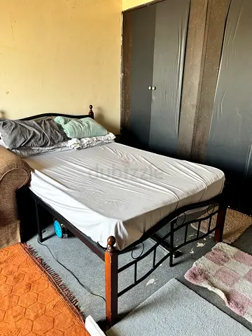 Couple bed and sofa with 2 doors cupboard