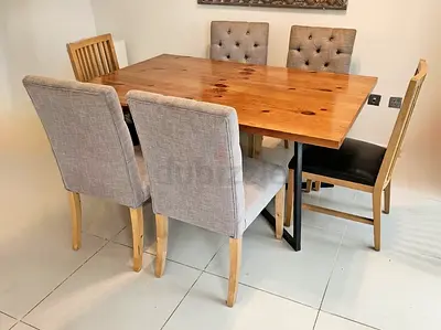 HOME CENTER Solid Wood Dining Table with 6 Mixed Chairs - Good Condition for at 250 aed only