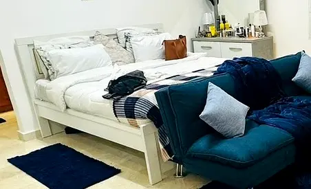 White Wooden Double Bed Frame with Side Cabinet and Blue Lounge Chair (Used)