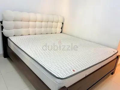 A 1.8-meter bed set including a bed frame, a mattress and two nightstand