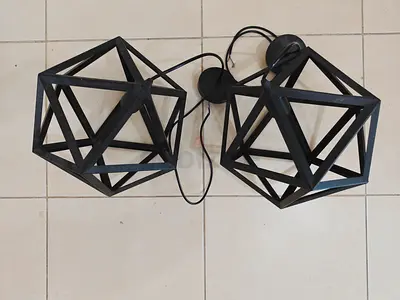 Pair of geometric black metal pendant light fixtures