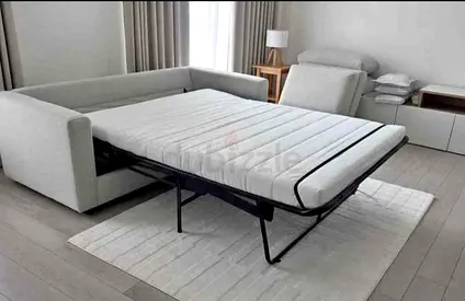 Light grey 2-seater sofa bed with pull-out mattress