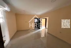 Two-bedroom apartment with a spacious living room for rent in Al Rawda