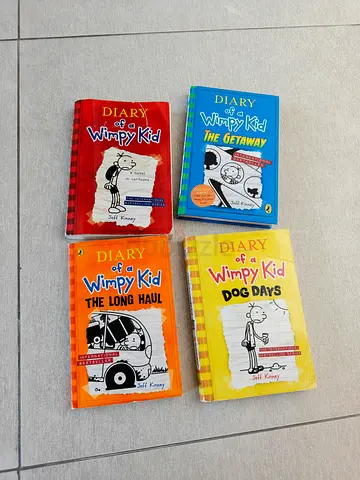 Set of 4 Diary of a Wimpy Kid books — classic Jeff Kinney childrens series