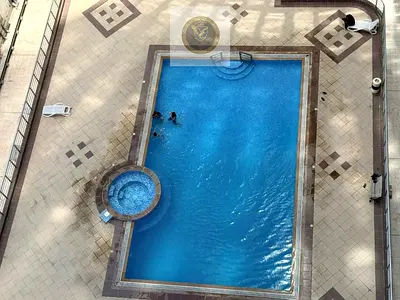 Two bedroom and hall for annual rent in Al Mamzar Sharjah built in wardrobes 3 bathrooms elegant finishing 2 balconies free parking free gym free swim