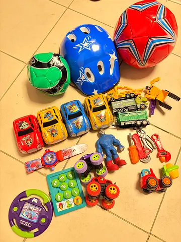 Mixed kids toys bundle — cars, helmets, balls, action figures, puzzles (used)