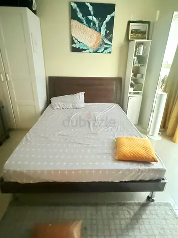 Queen sized wooden Cot with shelf on both sides . Very good condition.