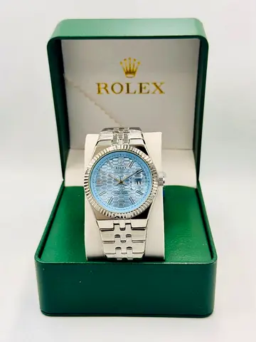 Rolex stainless steel watch with blue patterned dial in original box