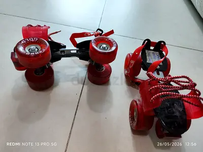 Adjustable Red Clip-On Quad Roller Skates - Pair