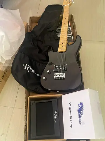 Rise electric guitar bundle with practice amp and gig bag- never used perfect condition includes box