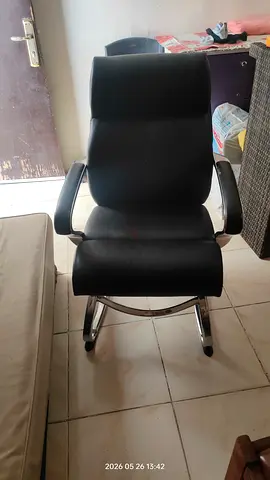 Black leather office visitor chair with chrome frame