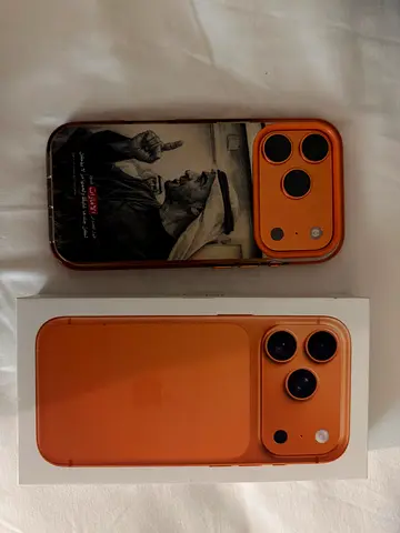 iPhone 17 Pro (orange) with original box and case