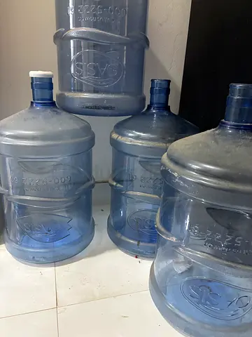 OASIS - 4 empty water bottles  - used.                      5 gallons
