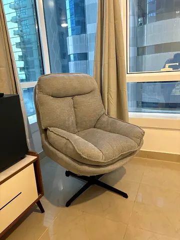 Comfortable Grey Swivel Accent Chair in Brand New Condition and rarely used.