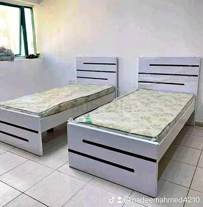 Pair of single beds with headboards - white wooden frames