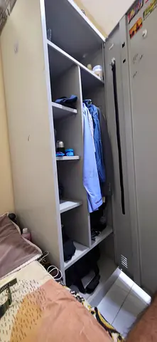 Grey metal wardrobe/locker with shelves and hanging space - used