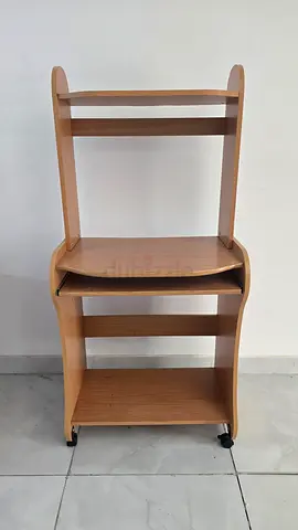 Compact wooden computer desk with shelves on wheels