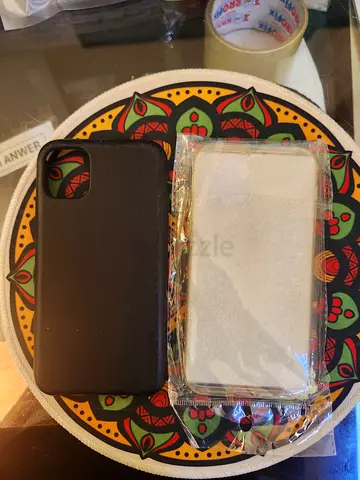 2 iPhone silicone cases (black + clear) — good condition
