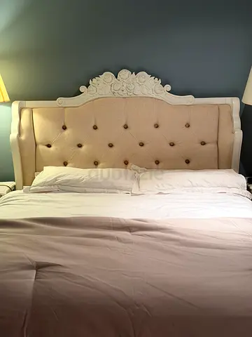 Queen size upholstered bed with carved headboard - cream