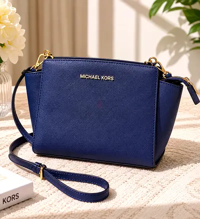 Micheal Kors sling bag with gold hardware - good condition