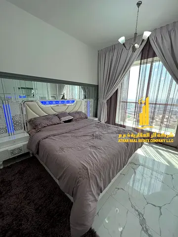 Luxurious one-bedroom apartment with brand new furnishings for monthly rent in Ajman - Al Rashidiya 1 - Oasis Towers