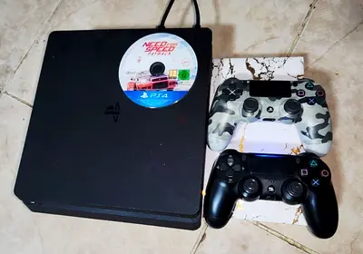 Sony PS4 Slim with 2 Controllers and Need for Speed Game
